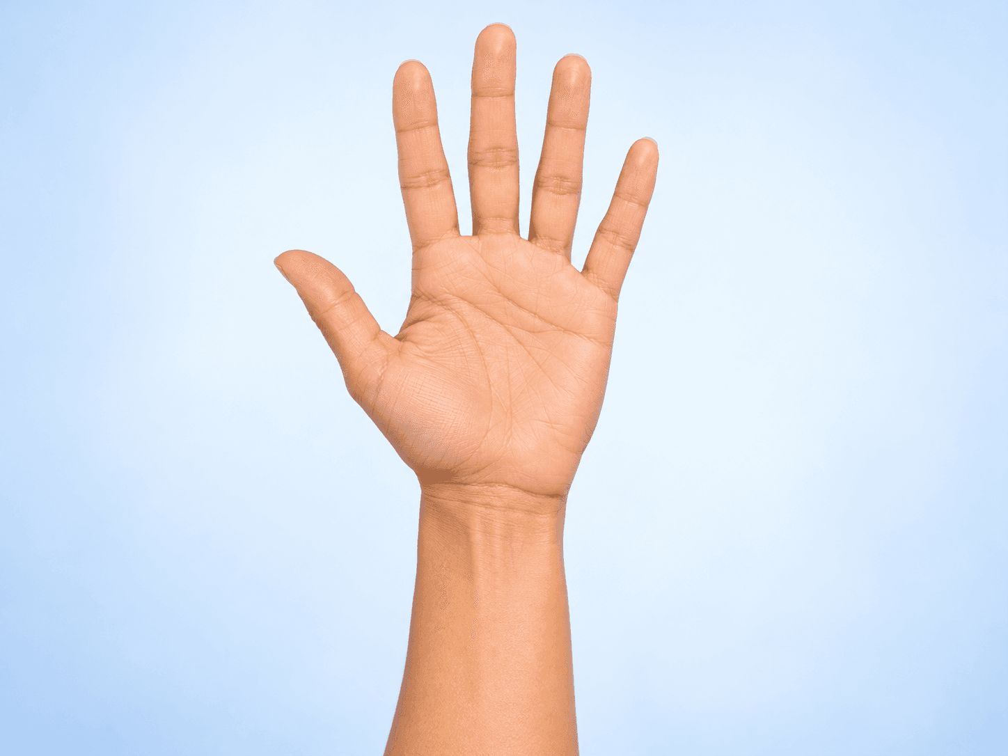 An open palm facing the viewer, with the wrist visible below it.